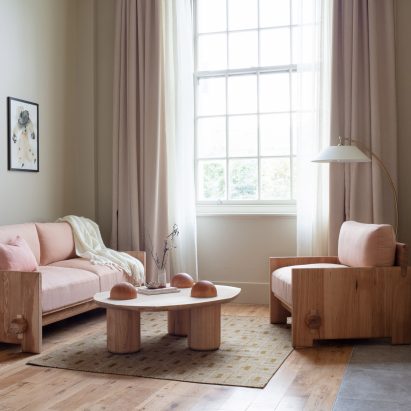 Living room of suite 109 in Town Hall Hotel with pink-upholstered sofa and armchair by Jan Hendzel at LDF