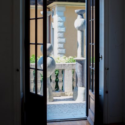 Two totems outside a window