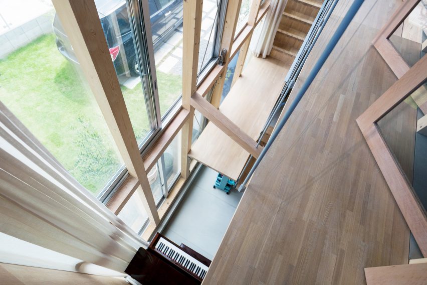 Looking down into piano, Light-Filled Stair Hall by Kiri Architects