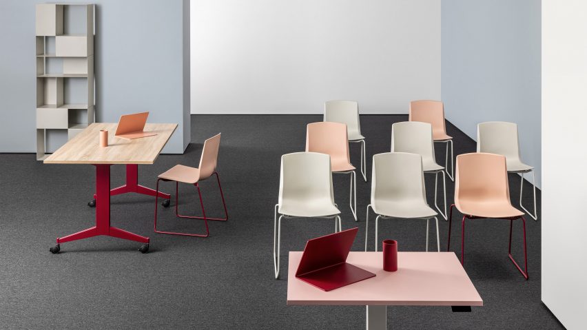 Photograph showing workspace with chairs in rows and desk