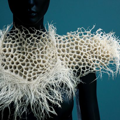 A mannequin wearing an organic-shaped collar