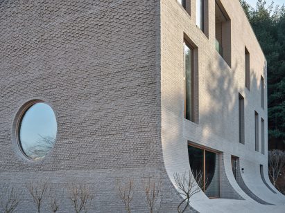 Corner of Cafe Teri by Nameless Architecture with sloping walls