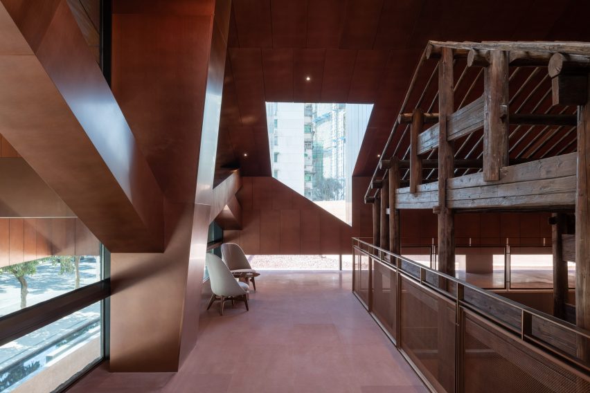 Neri&Hu incorporates historic wooden structure into copper-clad tea rooms