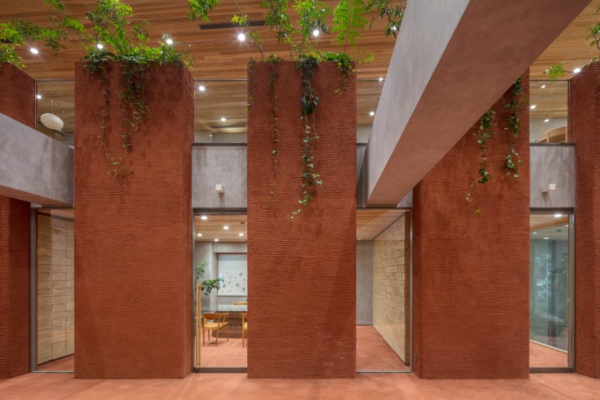 Nori Architects uses natural materials and cedar log columns to retrofit Japanese office