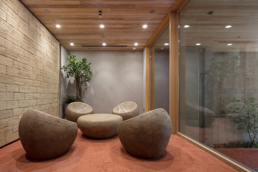Nori Architects uses natural materials and cedar log columns to retrofit Japanese office