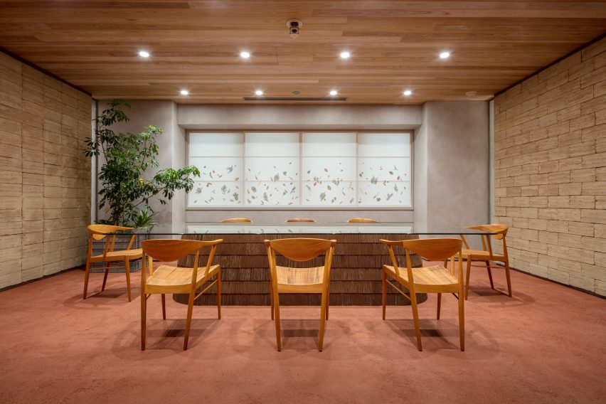 Nori Architects uses natural materials and cedar log columns to retrofit Japanese office