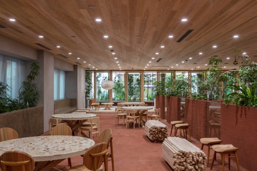 Nori Architects uses natural materials and cedar log columns to retrofit Japanese office