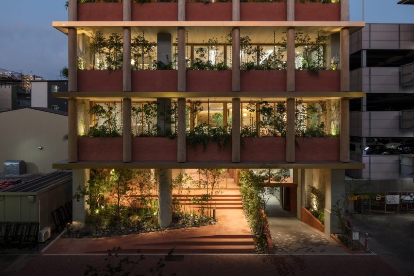 Nori Architects uses natural materials and cedar log columns to retrofit Japanese office