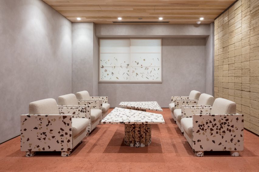 Nori Architects uses natural materials and cedar log columns to retrofit Japanese office