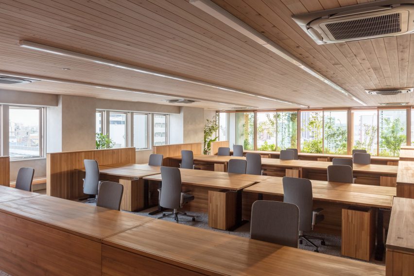 Nori Architects uses natural materials and cedar log columns to retrofit Japanese office