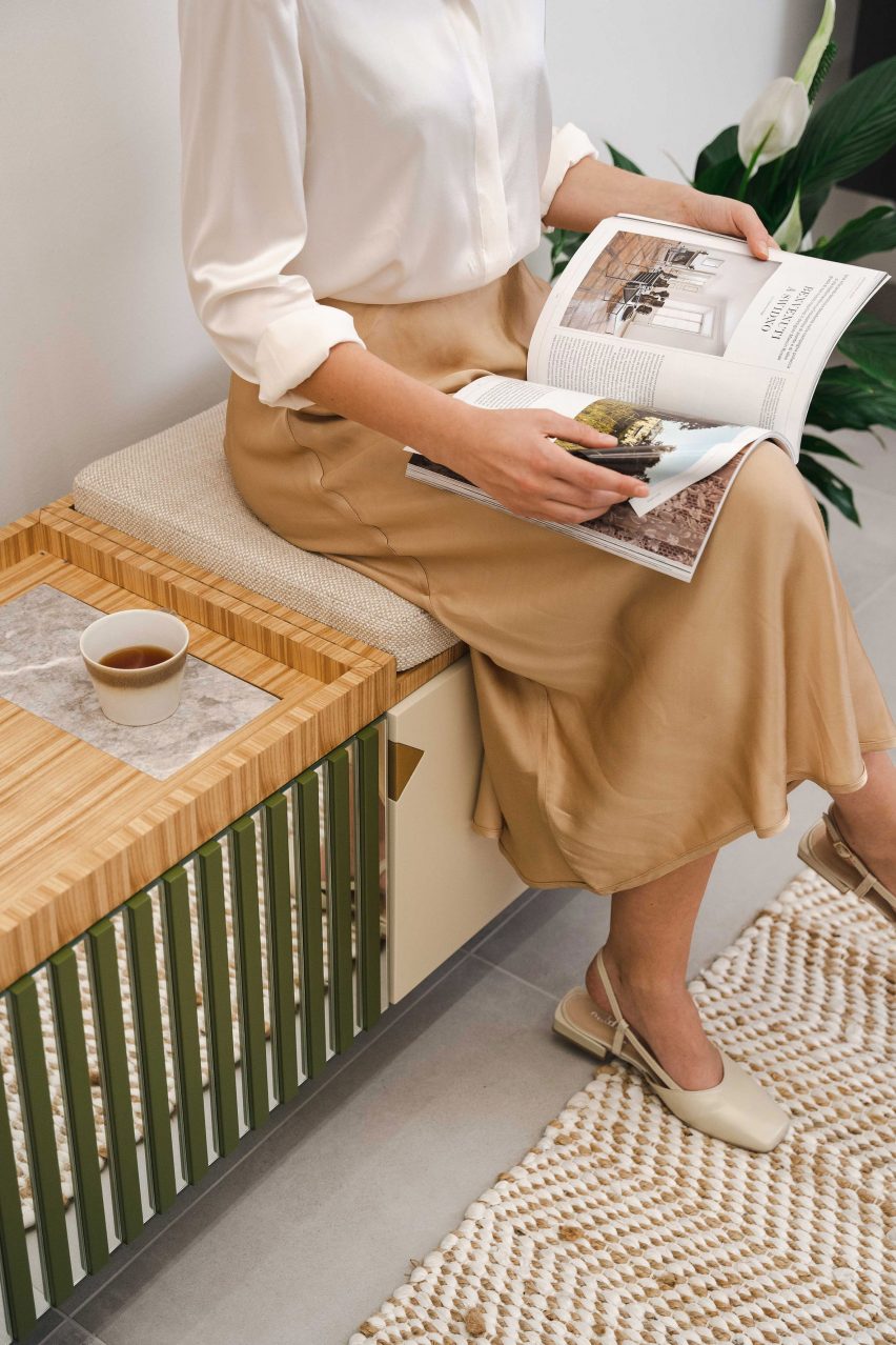 Close up of a person sitting on the Panarea sideboard