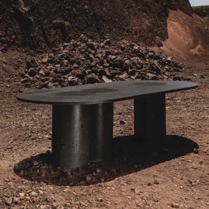 Peca's Petra dining table celebrates the "raw beauty" of volcanic stone