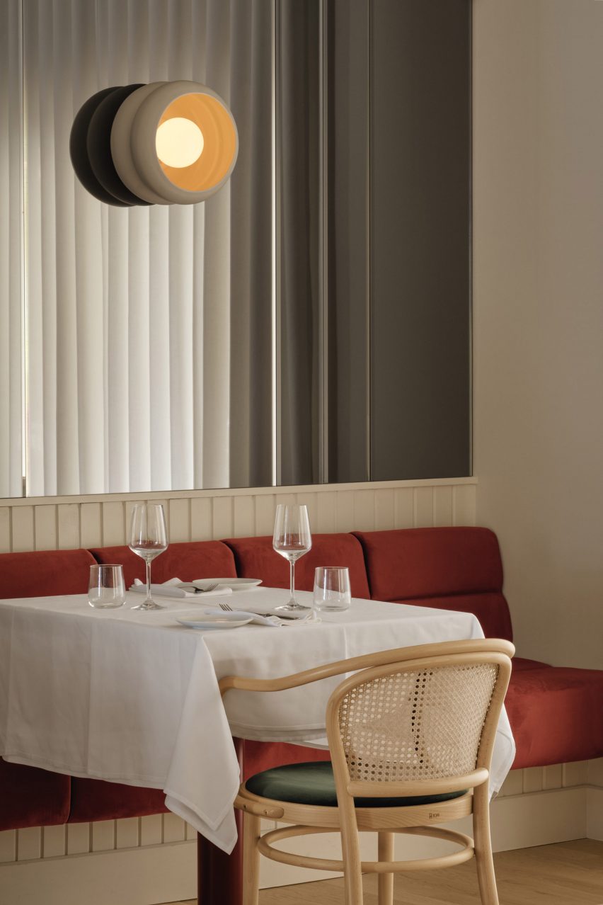 Sienna banquette below a mirrored wall
