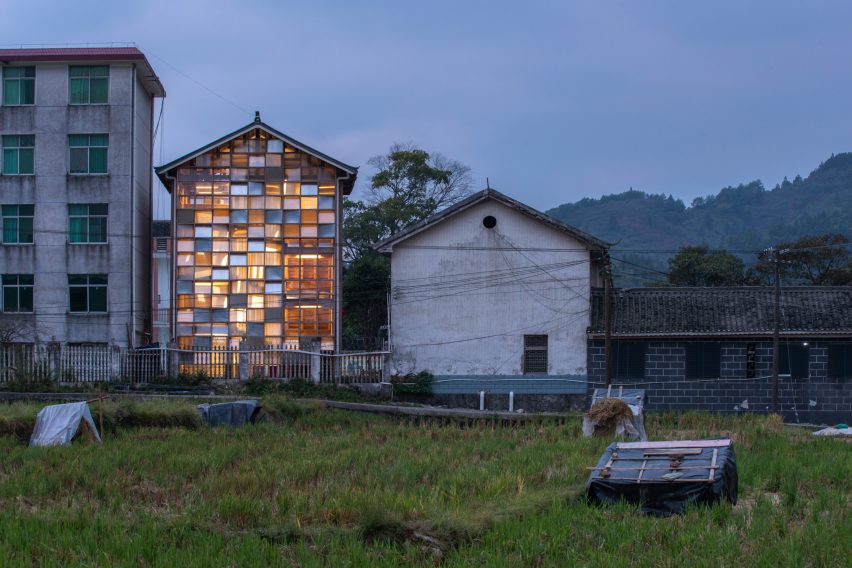 Exterior of the Pingtan Book House window facade and the nearby rice fields