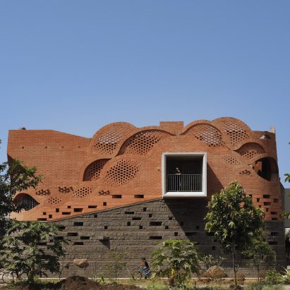 Exterior image of Gadi House and its waved brick facade