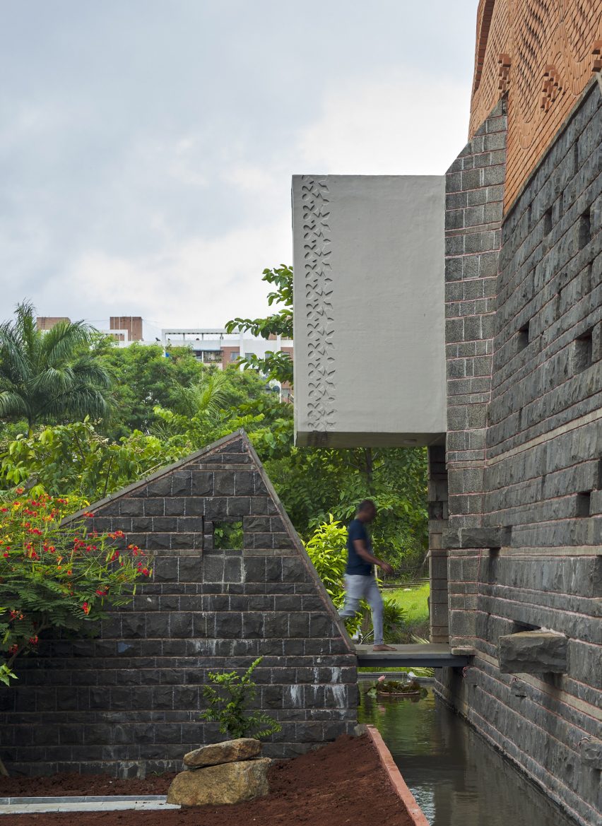 PMA madhushala wraps Indian home in perforated wall of brick and stone