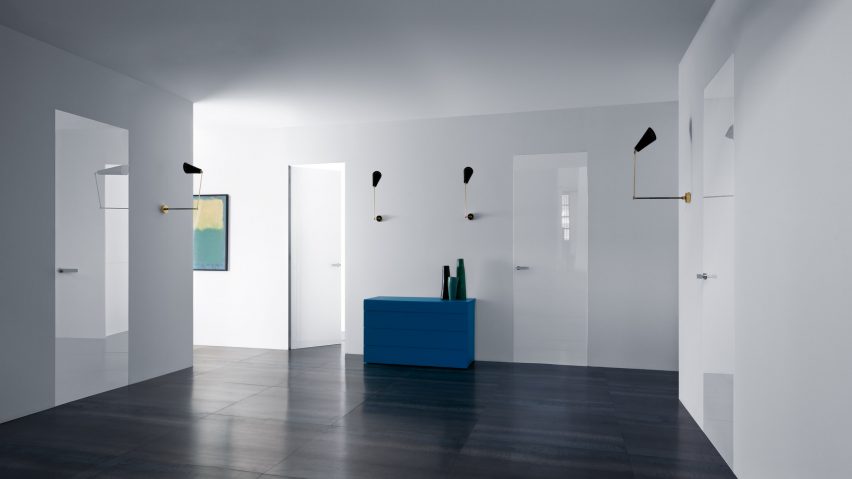 Photograph showing residential hallway with white glazed doors
