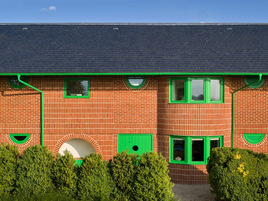Green doors and windows of Red House by David Kohn Architects