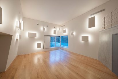Back-lit panels sticking out of walls in foyer of Tokyo building