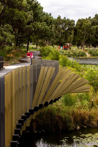 Steel structure over pond with metal fins