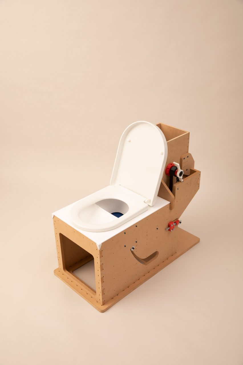 Prototype of Sandi toilet built from MDF with plastic seat and levers
