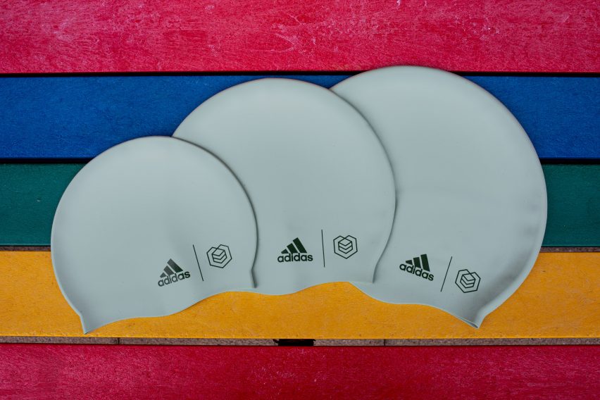 Three green swimming caps by Adidas and Soul Cap