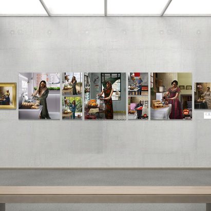 Artwork of people cooking on a gallery wall