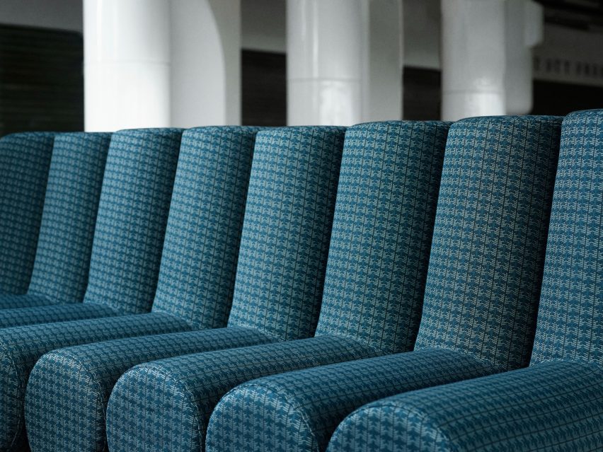 Photograph showing detail of green bench seat