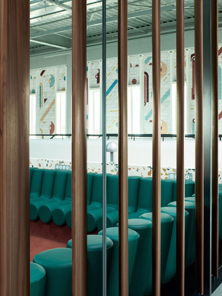 Photograph showing airport departure lounge with green bench seats