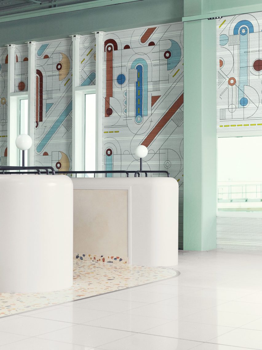 Photograph showing airport departure lounge with terrazzo flooring and abstract mural