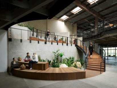 Round wooden office lounge in industrial building