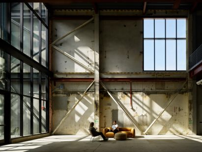 Industrial wall with office sofa in remodeled factory