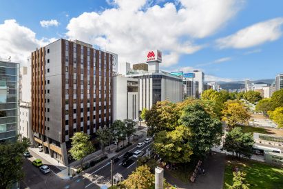 Hotel on tree-lined street in Sapporo, Japan