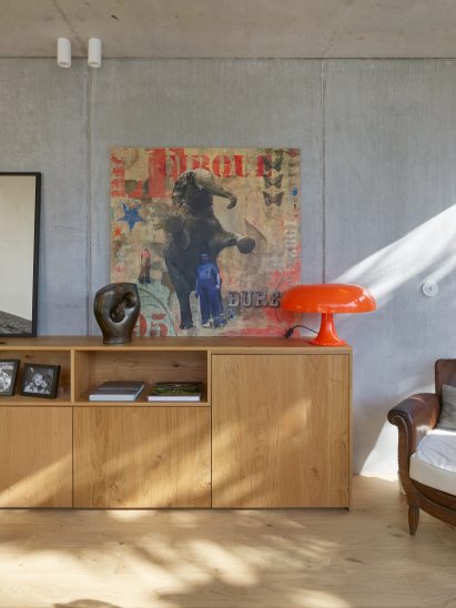 Wooden sideboard with orange lamp
