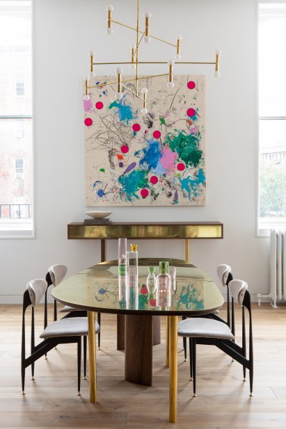 Dining room with custom brass and walnut furniture