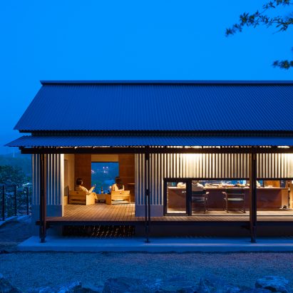 Exterior image of Bugok Friday House at dusk with views to the interior