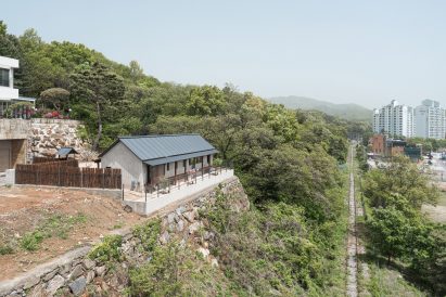 Image of Bugok Friday House pictured against the green surroundings