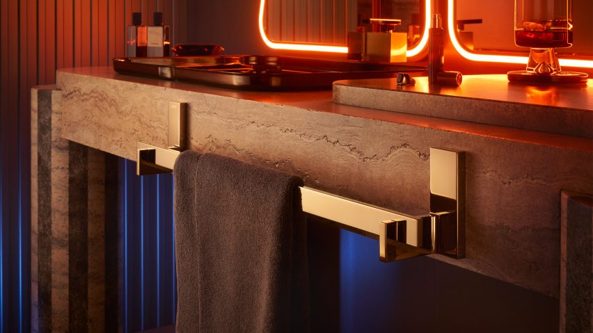 Gold towel rail by Axor on the edge of a bathroom sink
