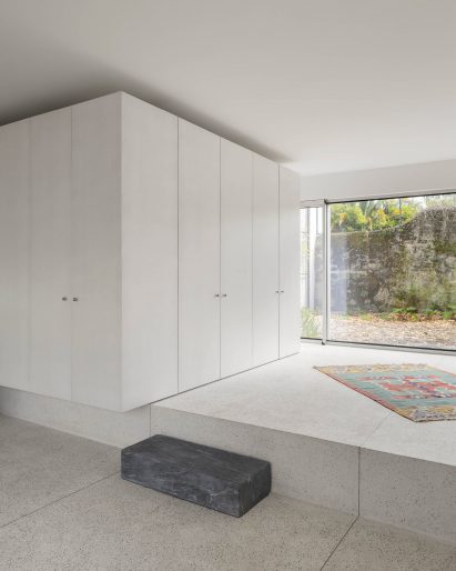 Apartment interior with stepped concrete floor