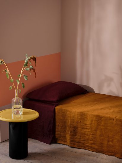 A photograph of a room painted with coral-coloured Graphenstone paint