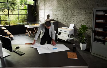 A photograph of a person working in an office