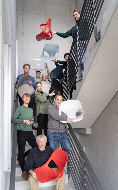 Staff at Herman Miller holding up parts of the Zeph chair