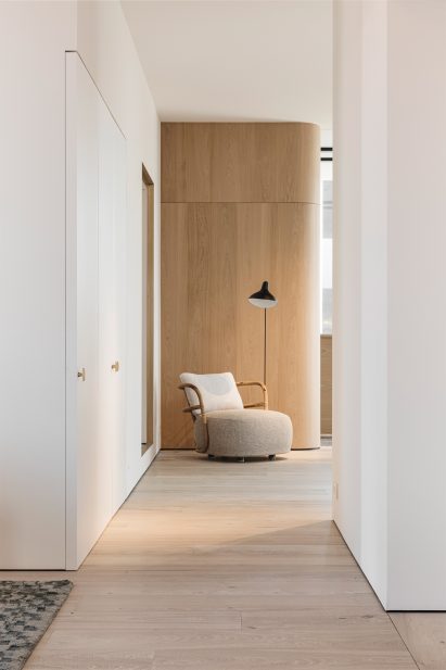 An interior featuring a wall glad in wood