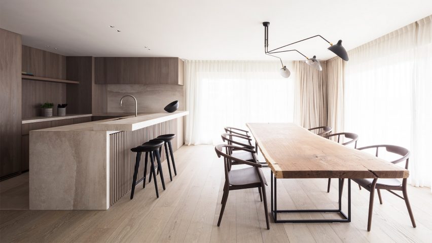 An interior and kitchen featuring wooden flooring and furniture