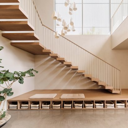 An interior featuring a wooden staircase