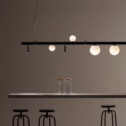 Track lighting installed above bar