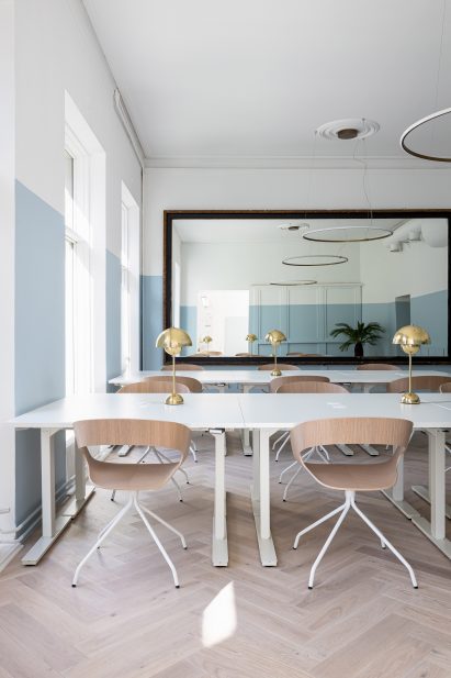 A photograph of an office space that uses Teknos blue and green paints