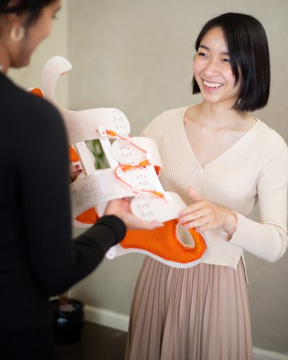 Designer with brace