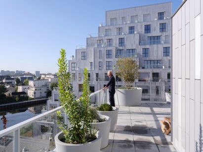 Man on terrace of French housing in Rennes