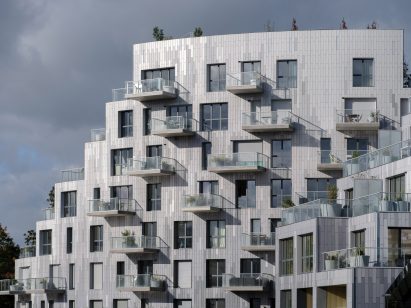 Grey-tiled housing with projecting balconies
